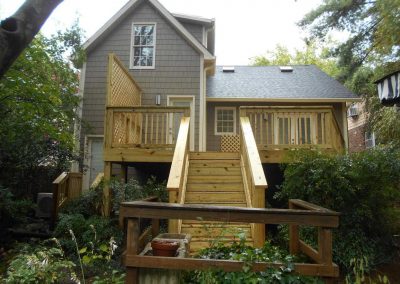 New wood deck built on the back of a house after a fire