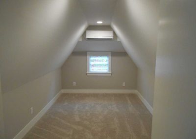 Guest bedroom renovated with new carpet after a fire damage