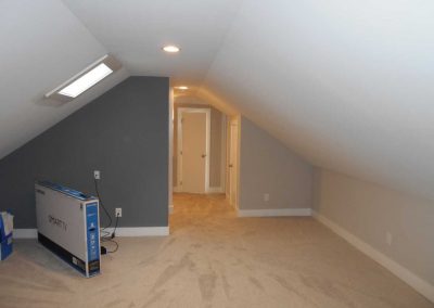 Renovated bonus room with new carpet and being damaged by fire