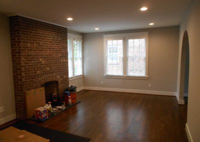 Renovated living room with fireplace after a fire damage