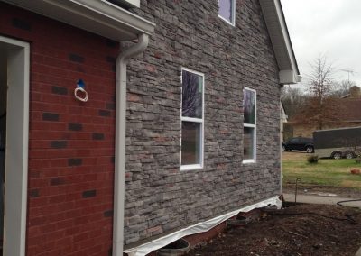 Front of a brick and stone once renovation from a fire damage was completed