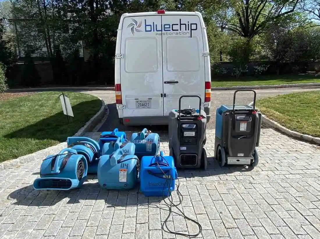 Blue Chip Restoration van with fans and dehumidifiers