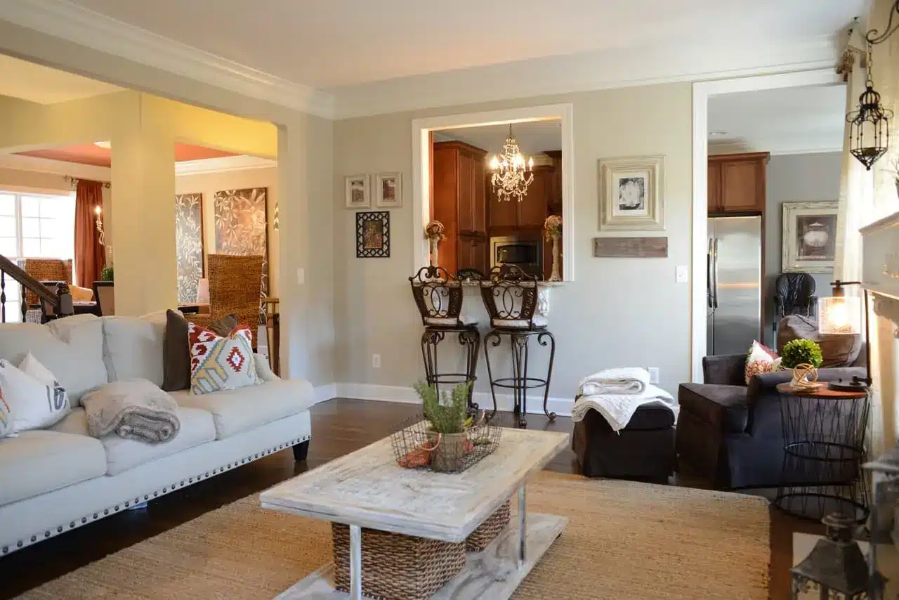 Furnished living room and open kitchen after water damage restoration.